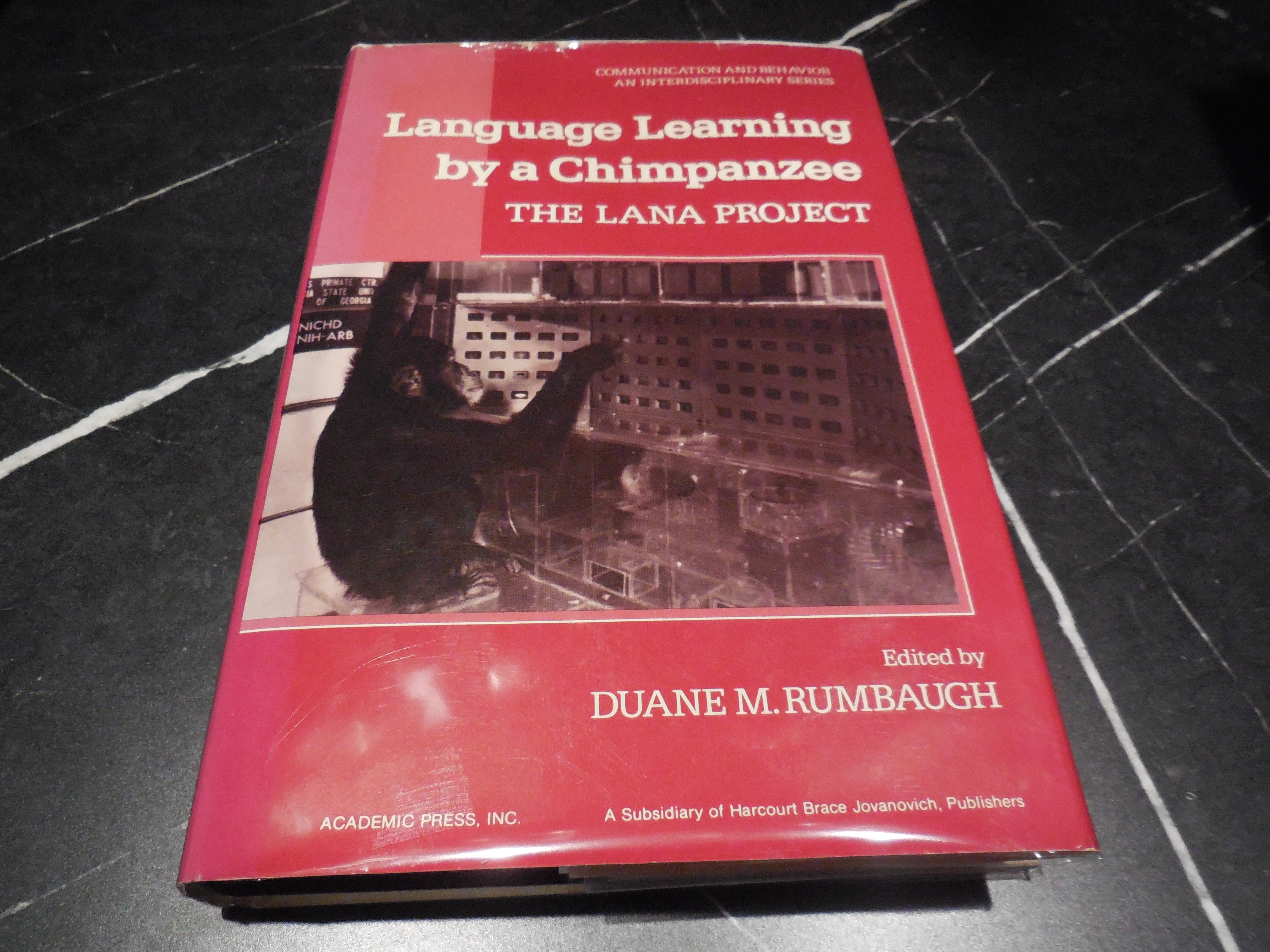 Language learning by a chimpanzee: The Lana project (Communication and behavior)